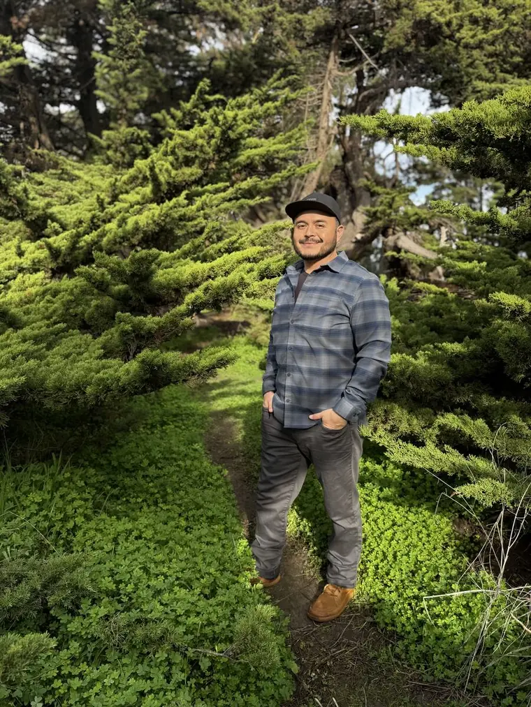 Fermin Cruz in a coastal cypress grove